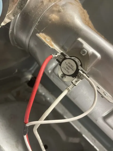Dryer heater housing with a thermal cut-off and its wiring