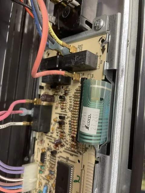 Relay control board inside an electric range